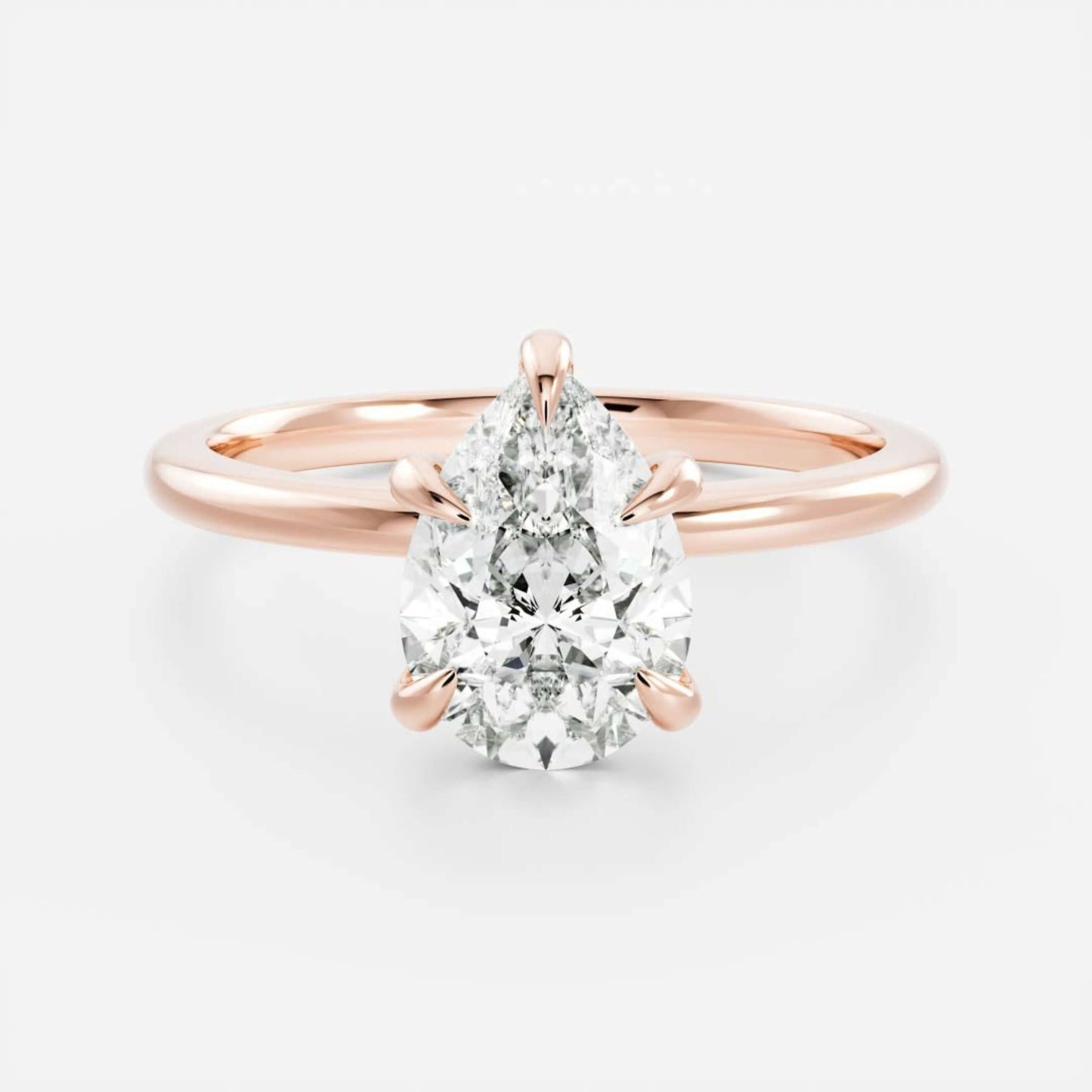Rose Gold Pear Cut Diamond Basket Style Ring