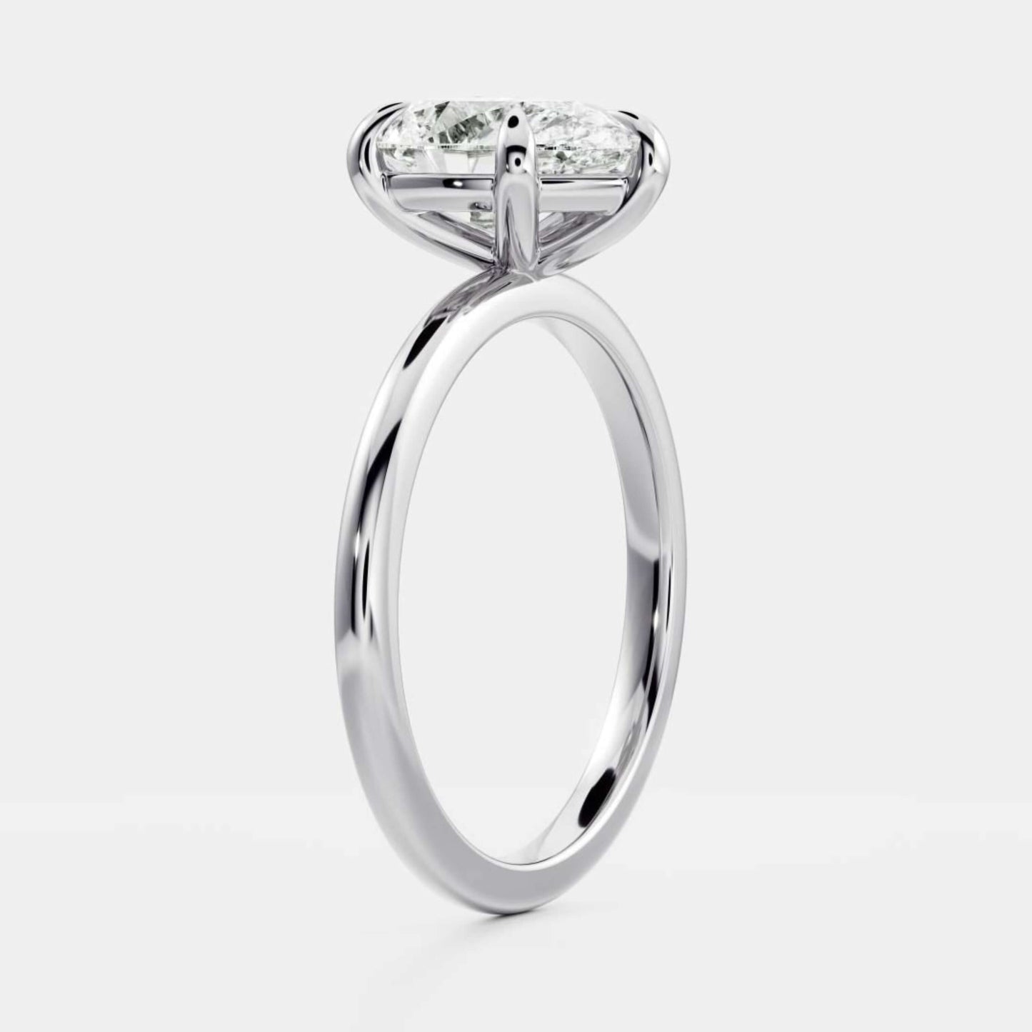 White Gold Pear Cut Diamond Basket Style Ring