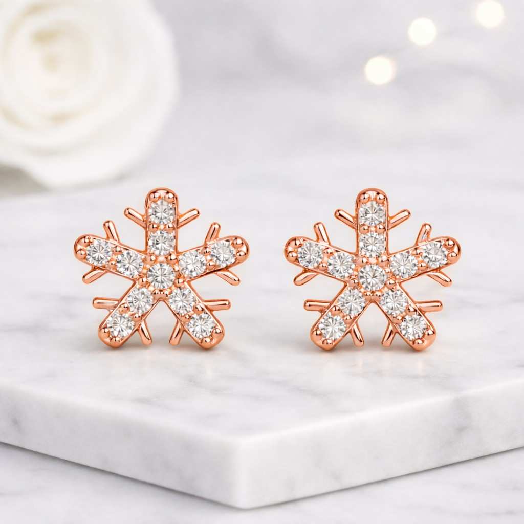 dainty winter snowflake diamond stud earrings in white gold