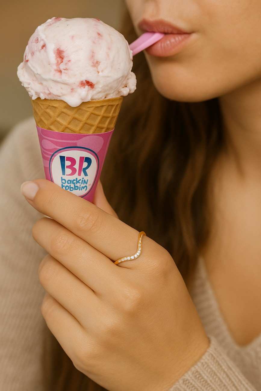 Curved wedding band created to fit around solitaire rings
