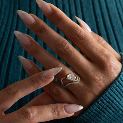 Curved wedding band designed to sit flush with engagement ring
