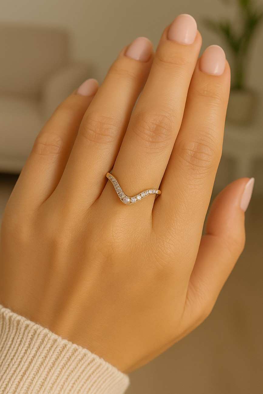 Curved wedding band shaped to follow the center stone ring

