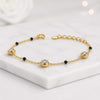 Lab Grown Diamond Gold Station Bracelet with Black Stone Accents