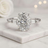 Oval And Tapered Baguette Diamond Three Stone Ring