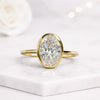 Oval Cut Lab Grown Diamond Bezel Set Engagement Ring