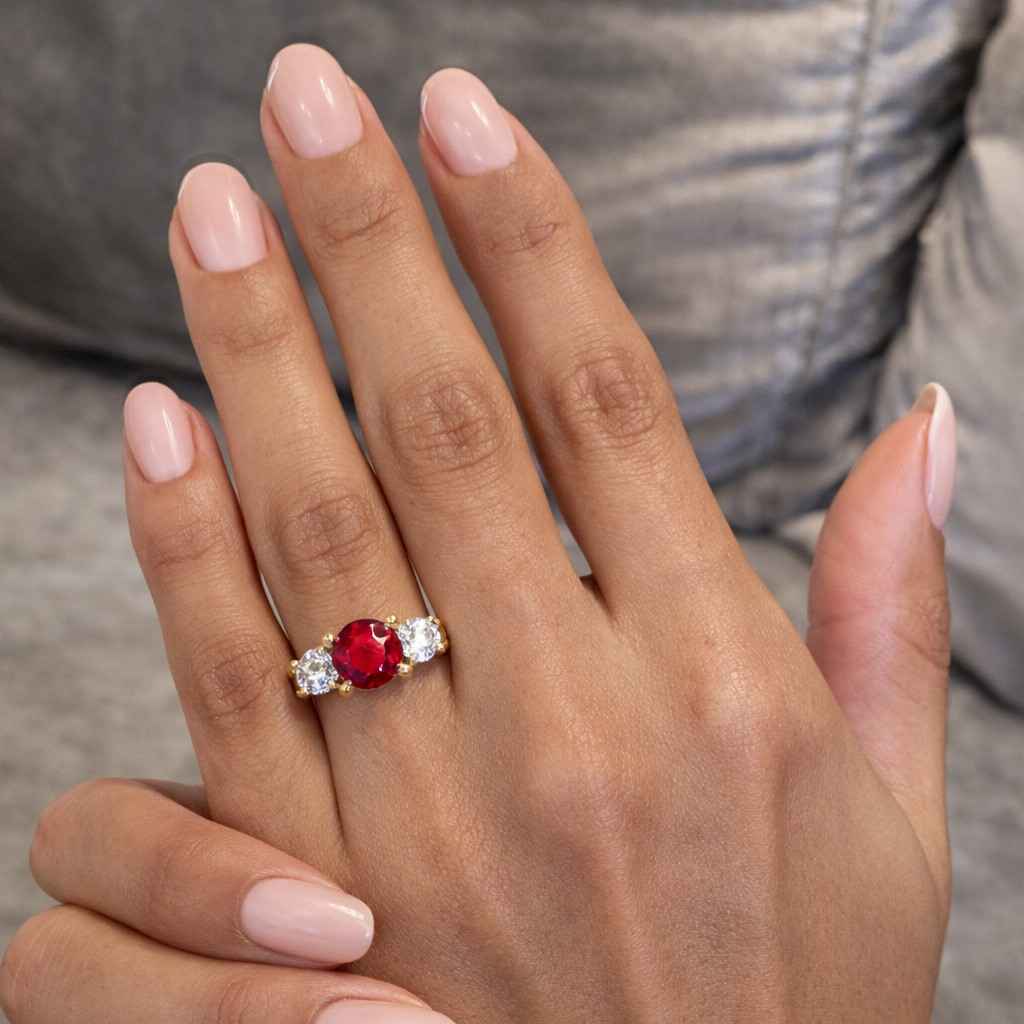 platinum hand engraved ruby and diamond trilogy ring