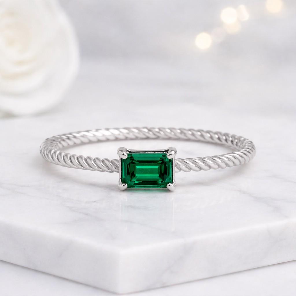 twisted green solitaire engagement ring
