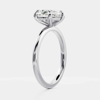 White Gold Pear Cut Diamond Basket Style Ring