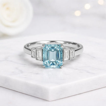 aquamarine engagement ring blue stone ring emerald cut gemstone rectangular gemstone ring baguette side stones bridal jewelry engagement jewelry wedding jewelry gemstone engagement ring luxury engagement ring modern engagement ring elegant engagement ring