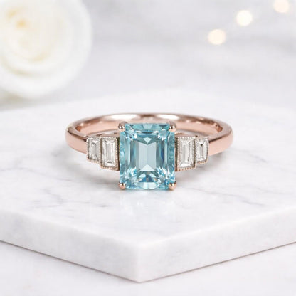classic engagement ring handcrafted ring artisan jewelry fine ring blue gem jewelry statement jewelry unique engagement ring proposal ring women jewelry ring design luxury gift gemstone accessory polished jewelry prong set ring rectangular cut ring sparkling gemstone delicate ring