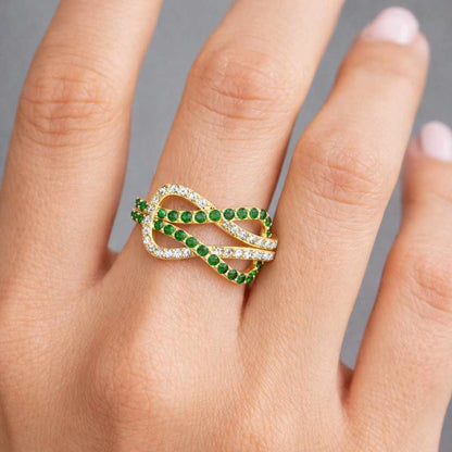 comfort fit ring polished ring gemstone band decorative ring feminine ring chic ring luxury ring everyday ring wedding band bridal ring crossover band infinity loop green crystal ring white stone ring designer ring artisan ring elegant jewelry