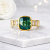 Cushion Cut Emerald and Emerald Side Stone Ring in 14K Yellow Gold