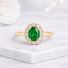Oval Cut Emerald Halo Ring in 14K Yellow Gold