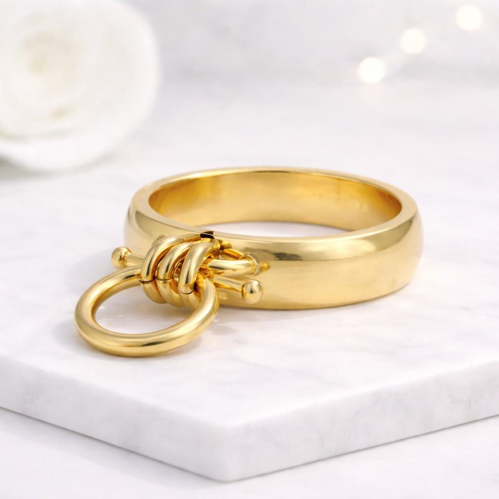 gold ring knot ring circle ring statement ring chunky ring band ring modern ring minimalist ring fashion ring women ring open ring loop ring dangling ring charm ring geometric ring unique ring bold ring polished ring shiny ring smooth ring metal ring designer ring trendy ring
