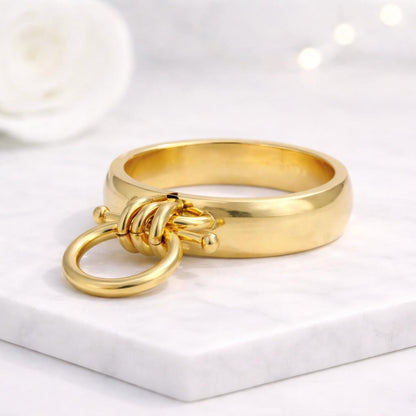 gold ring knot ring circle ring statement ring chunky ring band ring modern ring minimalist ring fashion ring women ring open ring loop ring dangling ring charm ring geometric ring unique ring bold ring polished ring shiny ring smooth ring metal ring designer ring trendy ring