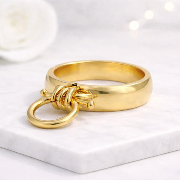 gold ring knot ring circle ring statement ring chunky ring band ring modern ring minimalist ring fashion ring women ring open ring loop ring dangling ring charm ring geometric ring unique ring bold ring polished ring shiny ring smooth ring metal ring designer ring trendy ring