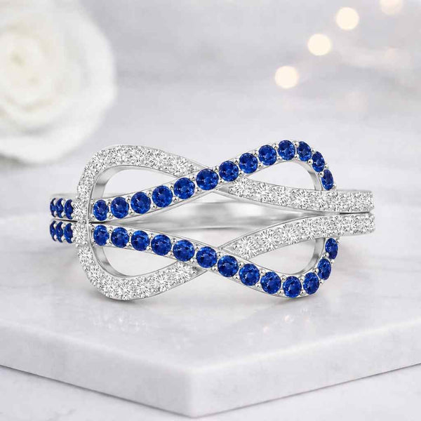 infinity ring blue stone ring sapphire ring crossover ring twist ring openwork ring statement ring women ring crystal ring silver ring loop ring figure eight ring elegant ring fashion ring gemstone ring anniversary ring