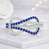 Round Cut Blue Sapphire Infinity Ring in 14K White Gold