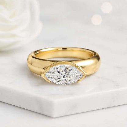 marquise solitaire bezel solitaire wide shank ring gold solitaire sleek band dome ring comfort band modern jewelry fine ring luxury ring classic jewelry simple jewelry clean style polished finish smooth finish bold jewelry everyday jewelry bridal jewelry
