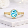 Oval Cut Blue Topaz Halo Pave Set Ring in 14K Yellow Gold