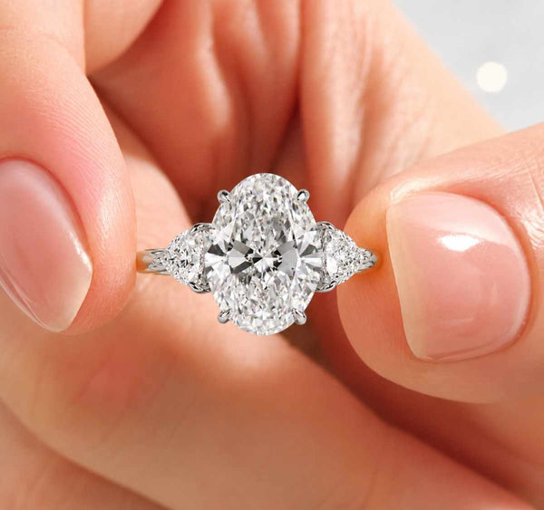 oval diamond ring trilogy ring three stone engagement ring oval center stone side stone ring
