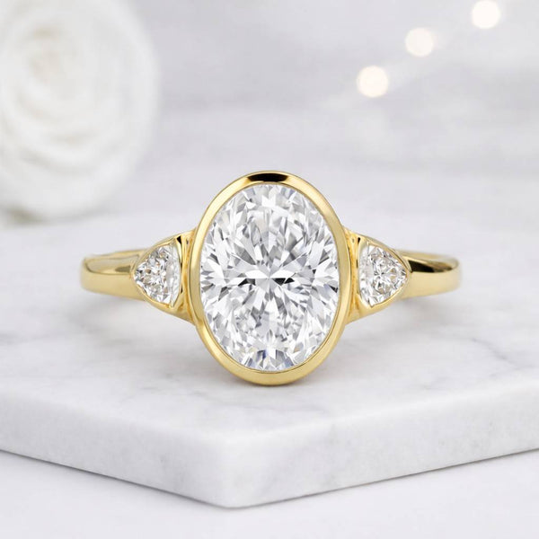 oval ring bezel ring engagement ring solitaire ring three stone ring side stone ring gold ring promise ring bridal ring fine jewelry oval center polished band
