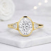 Oval Cut Lab Grown Diamond Three Stone Bezel Engagement Ring