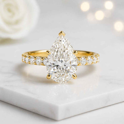 pear ring pear cut ring engagement ring solitaire ring gold ring statement ring bridal ring promise ring fine jewelry luxury ring women ring teardrop ring pave band ring prong setting ring elegant ring classic ring