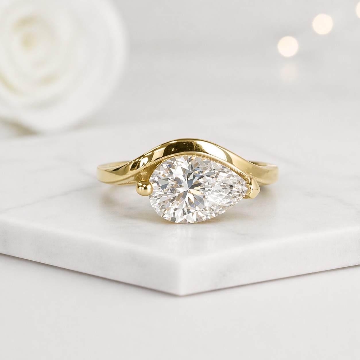 pear shaped ring gold engagement ring solitaire jewelry modern engagement ring bezel style ring open band ring curved ring elegant jewelry statement jewelry dainty jewelry