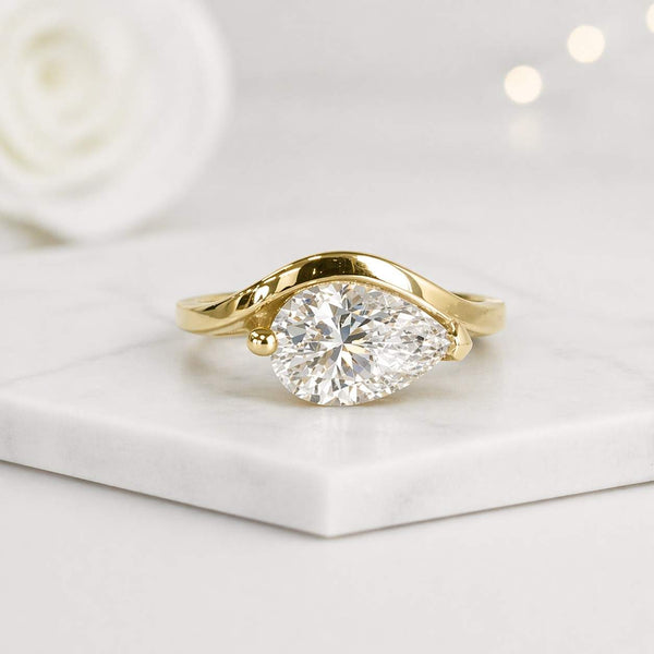 pear shaped ring gold engagement ring solitaire jewelry modern engagement ring bezel style ring open band ring curved ring elegant jewelry statement jewelry dainty jewelry