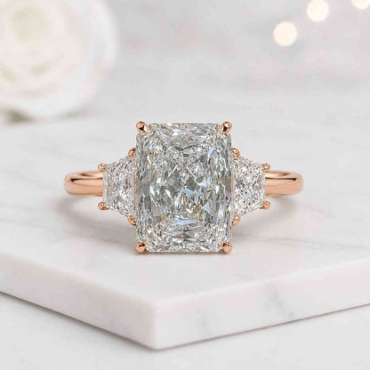 radiant engagement ring trapezoid side stones three stone engagement ring diamond look ring