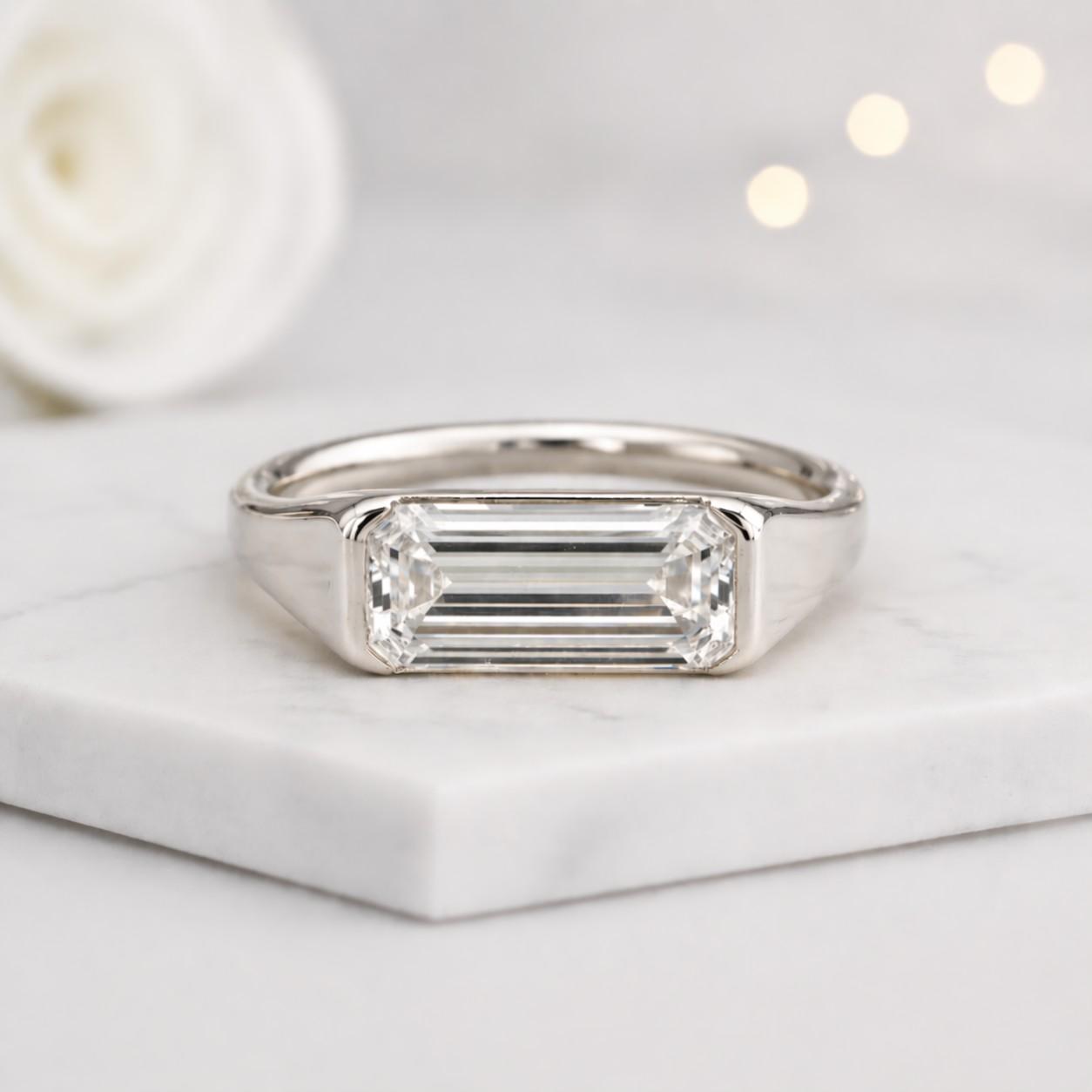 solitaire jewelry bezel gemstone emerald cut stone rectangle stone geometric stone sparkling jewelry luxury ring fine accessory premium ring modern accessory minimal accessory
