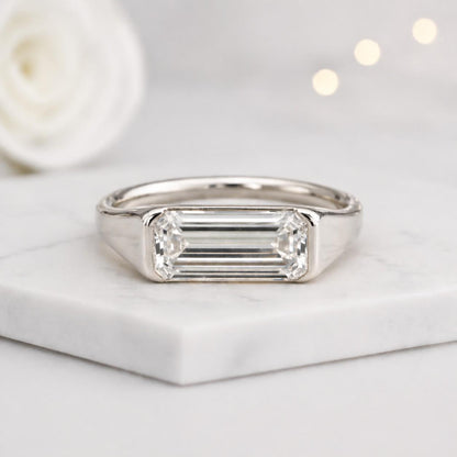 solitaire jewelry bezel gemstone emerald cut stone rectangle stone geometric stone sparkling jewelry luxury ring fine accessory premium ring modern accessory minimal accessory