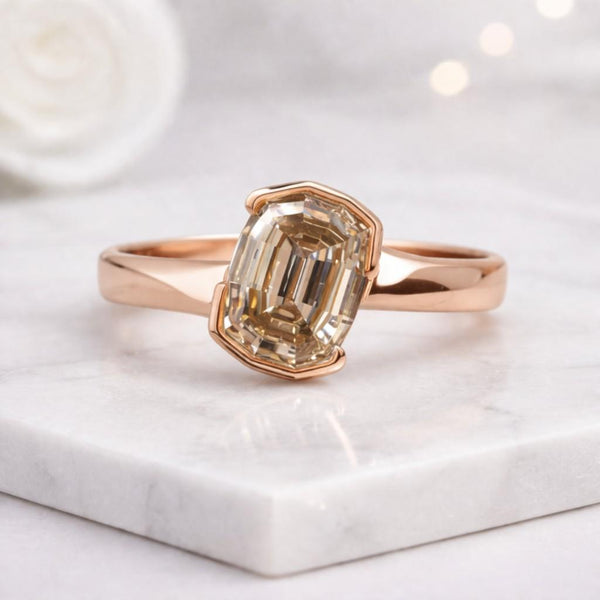 step cut cushion ring emerald cut ring bezel set ring solitaire ring rose gold ring thin band ring modern ring geometric ring faceted stone ring crystal ring womens ring statement ring sleek ring polished ring clean line ring elegant ring