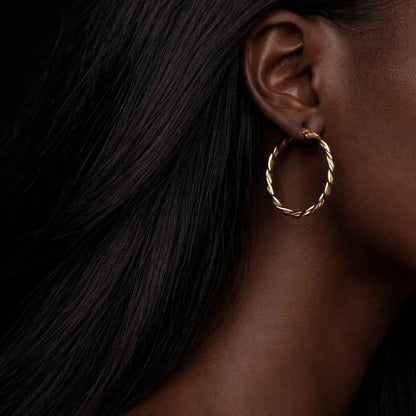 twisted jewelry gold circles classic jewelry modern jewelry minimalist hoops elegant earrings shiny gold hoops smooth finish earrings