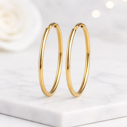 yellow gold hoops thin gold hoops round gold hoops endless gold hoops polished gold hoops sleek gold hoops shiny gold hoops simple gold hoops daily wear hoops lightweight gold hoops womens jewelry